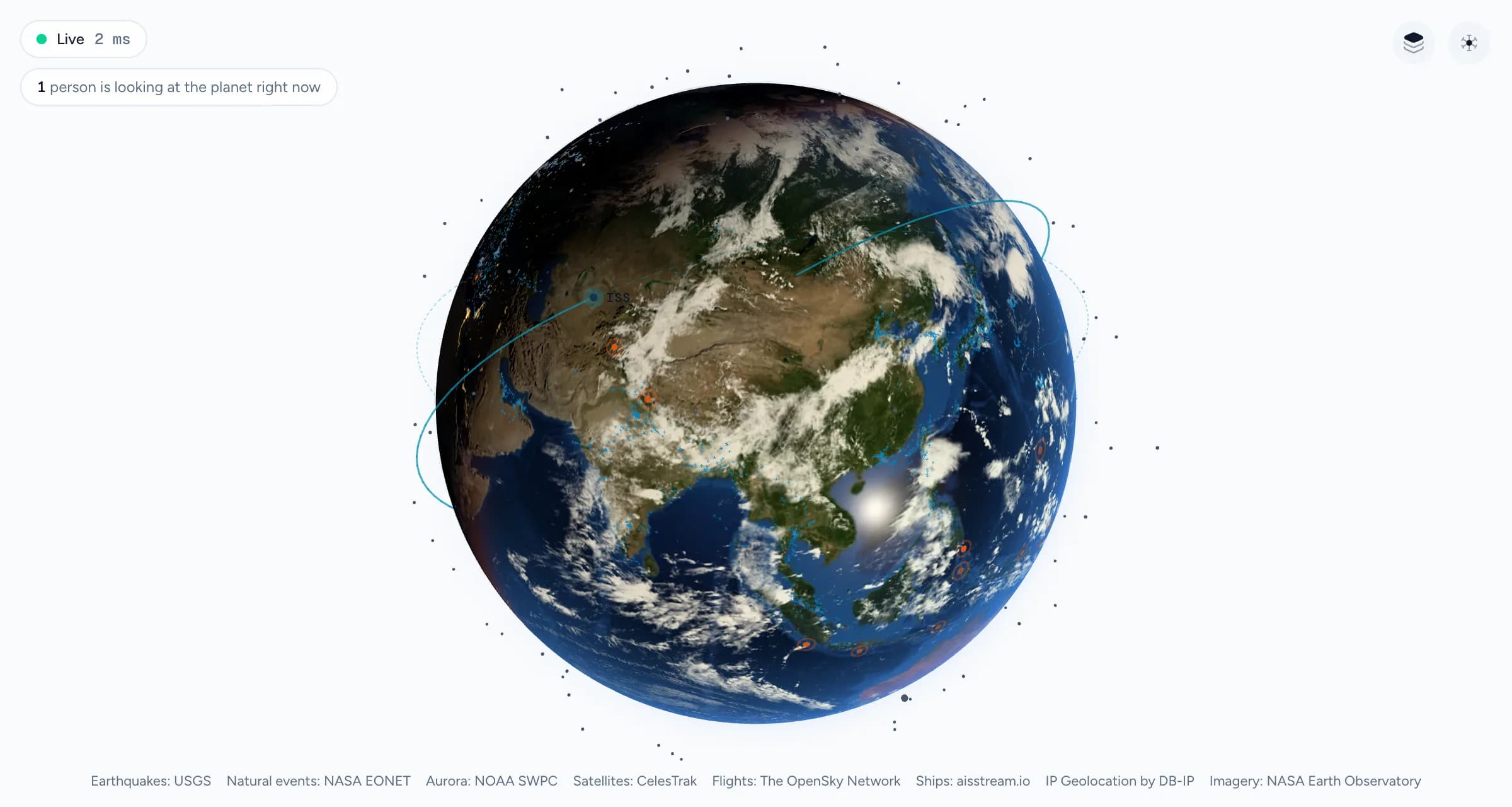 The same live globe over Asia in the light theme, on a pale background with dark satellites.