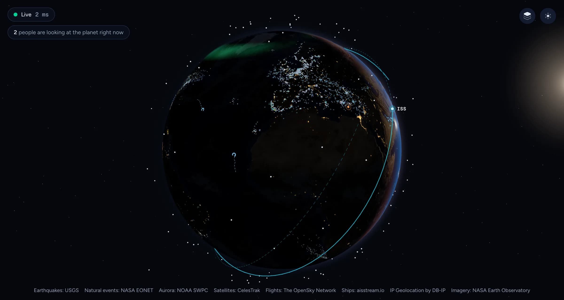 Europe and Africa on the night side of the globe, lit by cities, with flights over Europe, the aurora above the north and the sun rising at the edge.